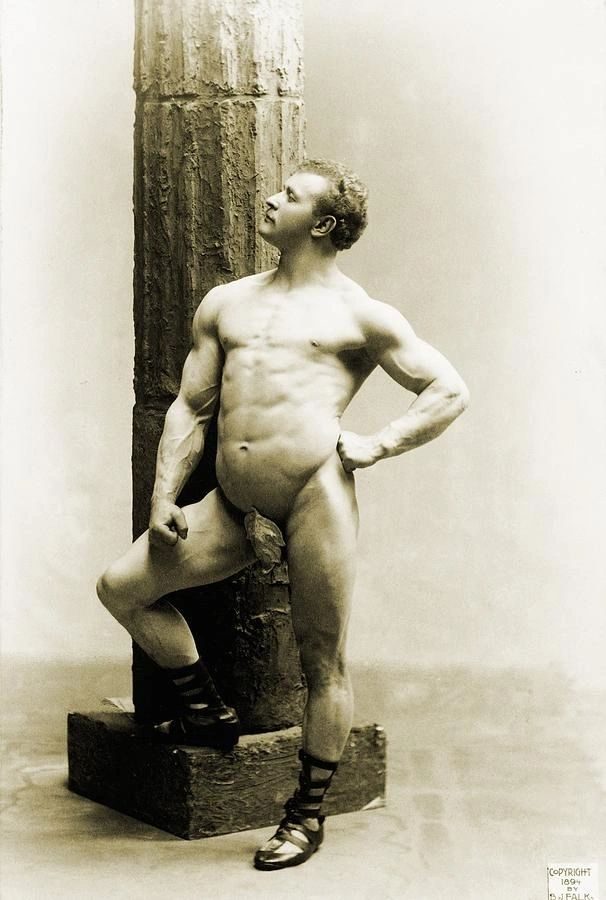 Vintage photo of strongman Eugen Sandow posing nude by a column, groin covered